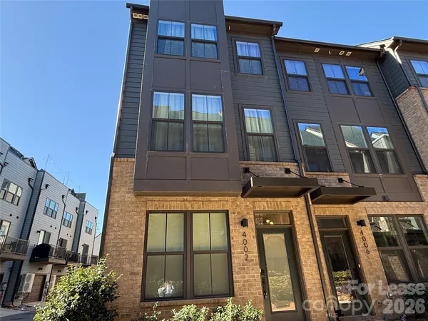 a front view of a building with lots of windows