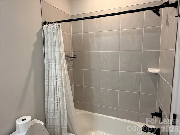a view of a storage & utility room with dryer and washer