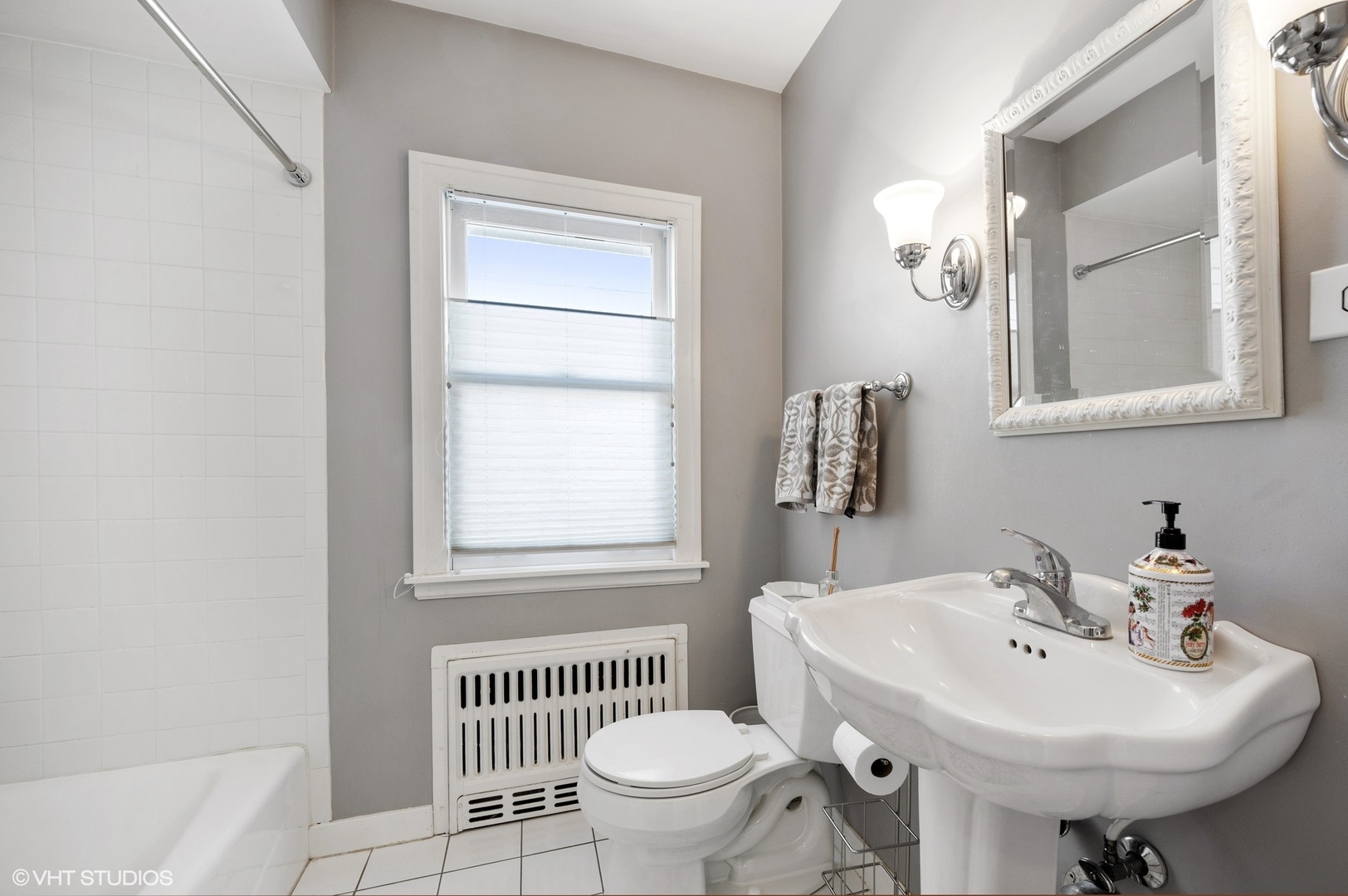 730 Forest Road Glenview, IL 60025 - Photo 22 of 37 a bathroom with a sink toilet and a mirror