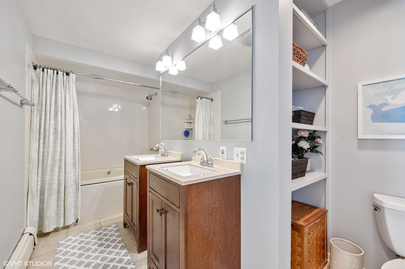 730 Forest Road Glenview, IL 60025 - Photo 23 of 37 a bathroom with a sink a toilet and shower