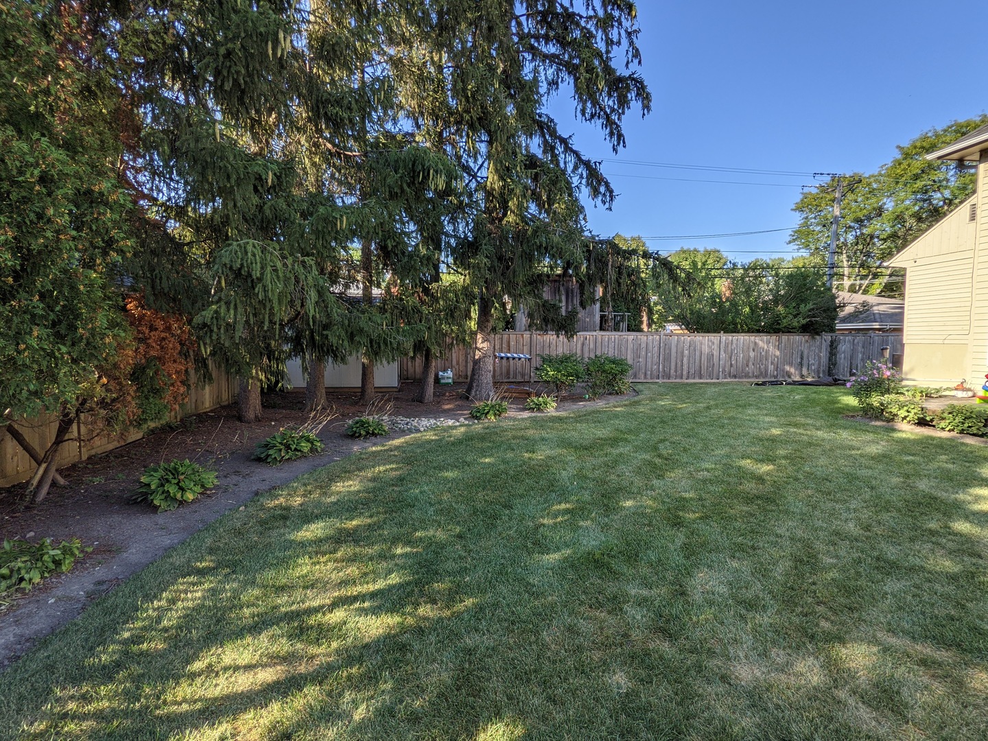 730 Forest Road Glenview, IL 60025 - Photo 32 of 37 a backyard of a house with lots of green space