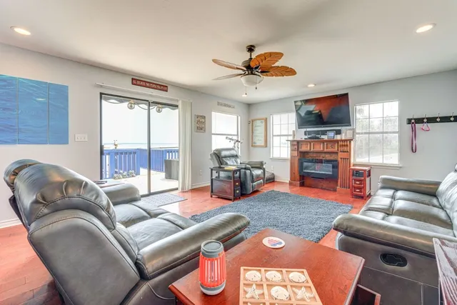 a view of a chairs and table in the balcony