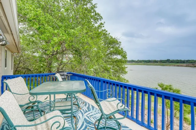 a view of a house with lounge chair and wooden floor