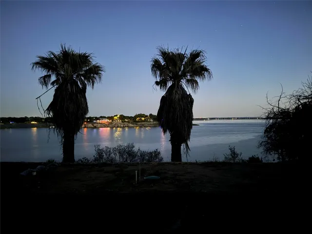 a view of deck with hardwood and lake view
