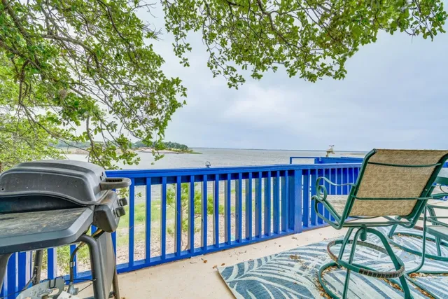 a view of a balcony with furniture