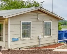 a small white house with a white roof