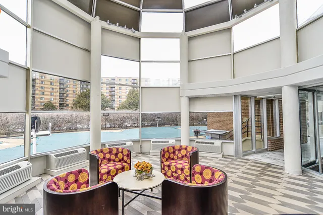 a outdoor space with the couches and dining table with the potted plant