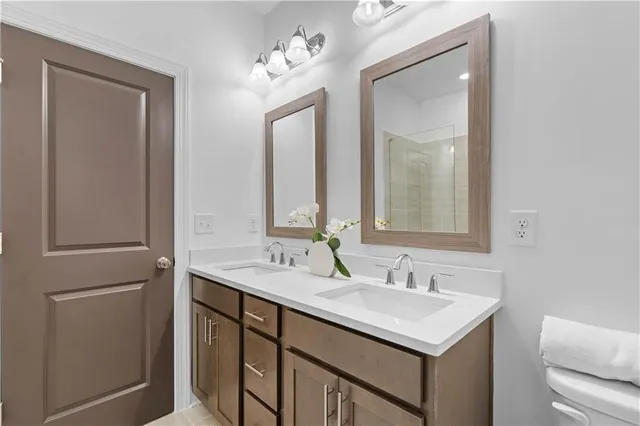 a bathroom with a sink vanity and a mirror