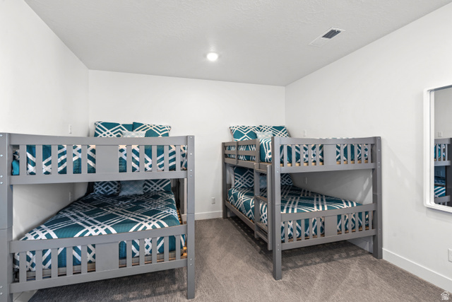 1122 South 1790th Street West, Unit 2 St. George, UT 84770 - Photo 18 of 37 Two bunk beds with gray wood frames and patterned bedding