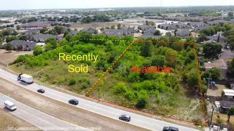 an aerial view of a houses with outdoor space