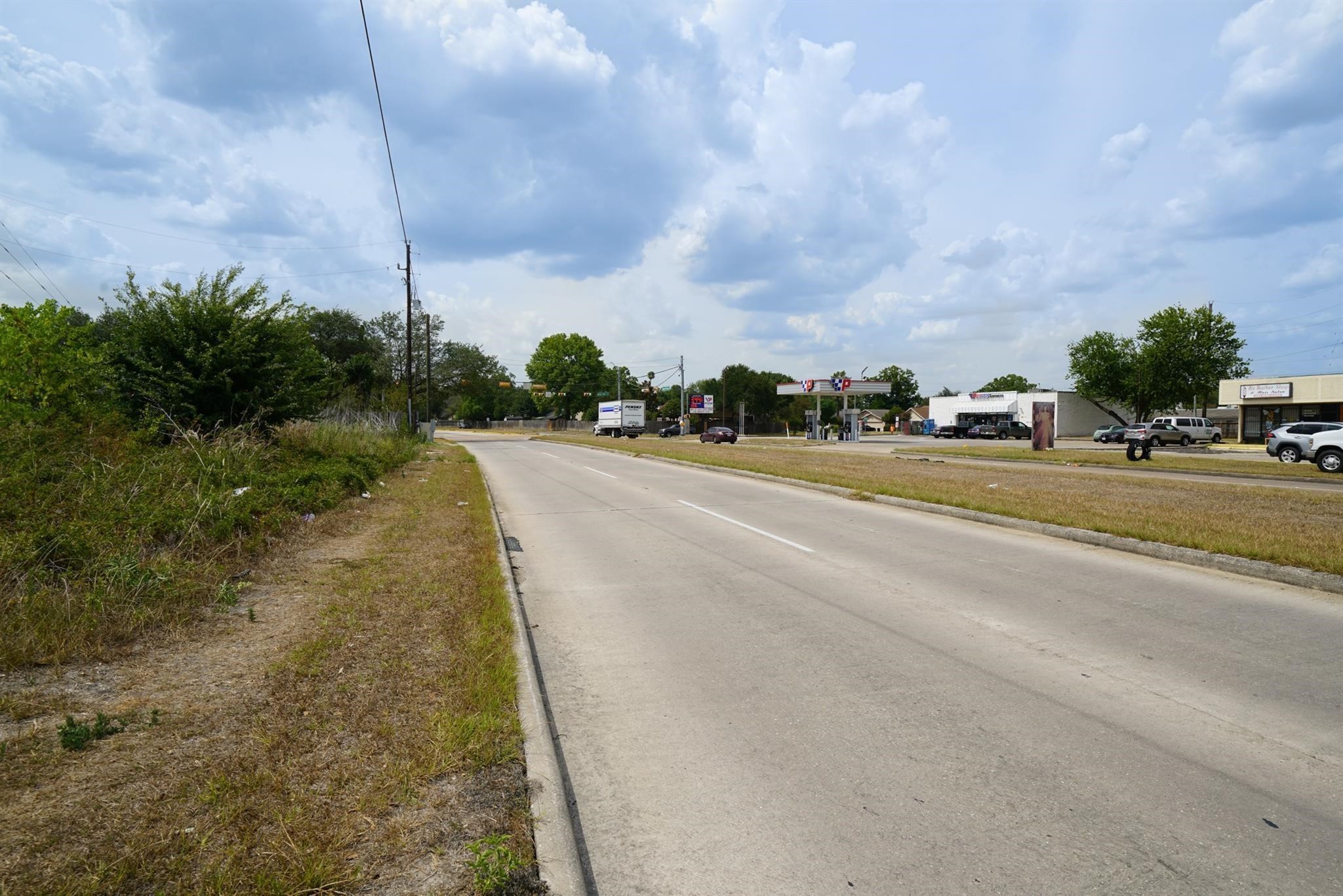 10307 Bammel North Houston Road Houston, TX 77086 - Photo 7 of 15 a view of a city street with a building in the background