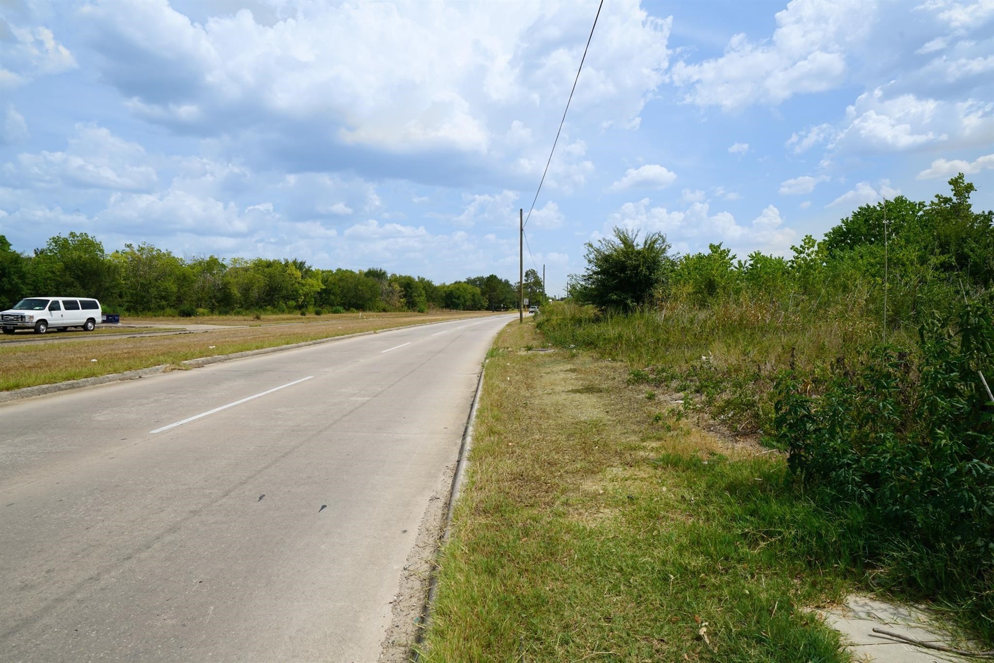 10307 Bammel North Houston Road Houston, TX 77086 - Photo 8 of 15 a view of a city street with a building in the background
