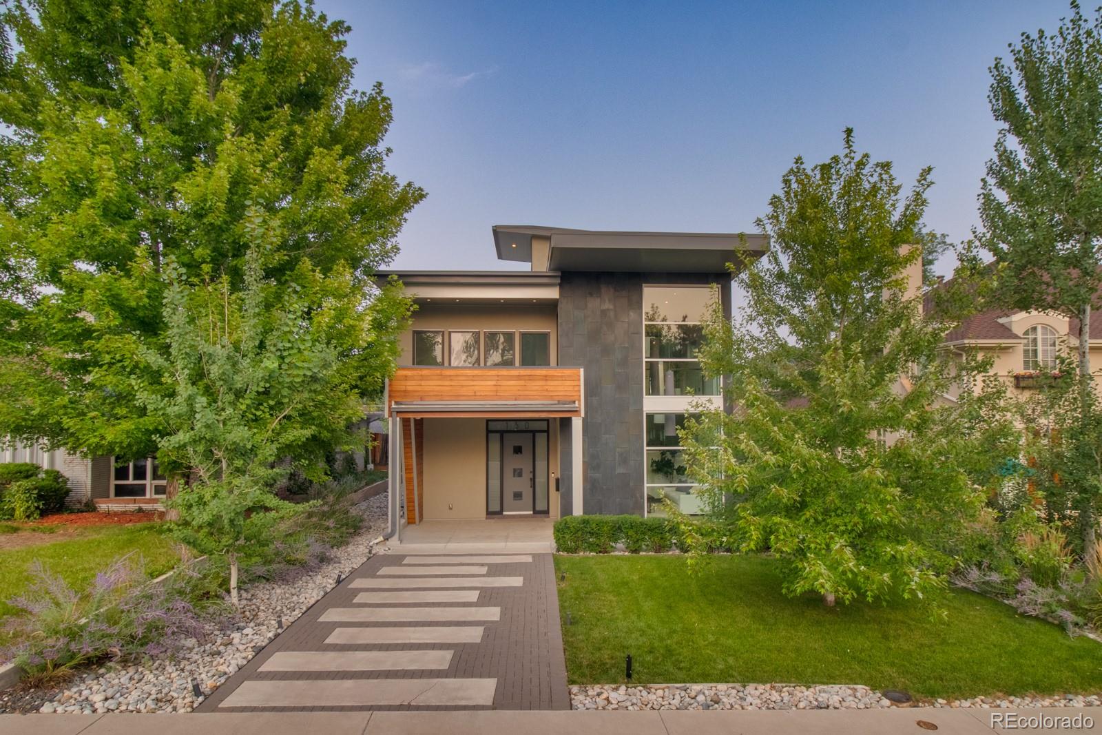 150 Hudson Street Denver, CO 80220 - Photo 1 of 33 a front view of a house with garden