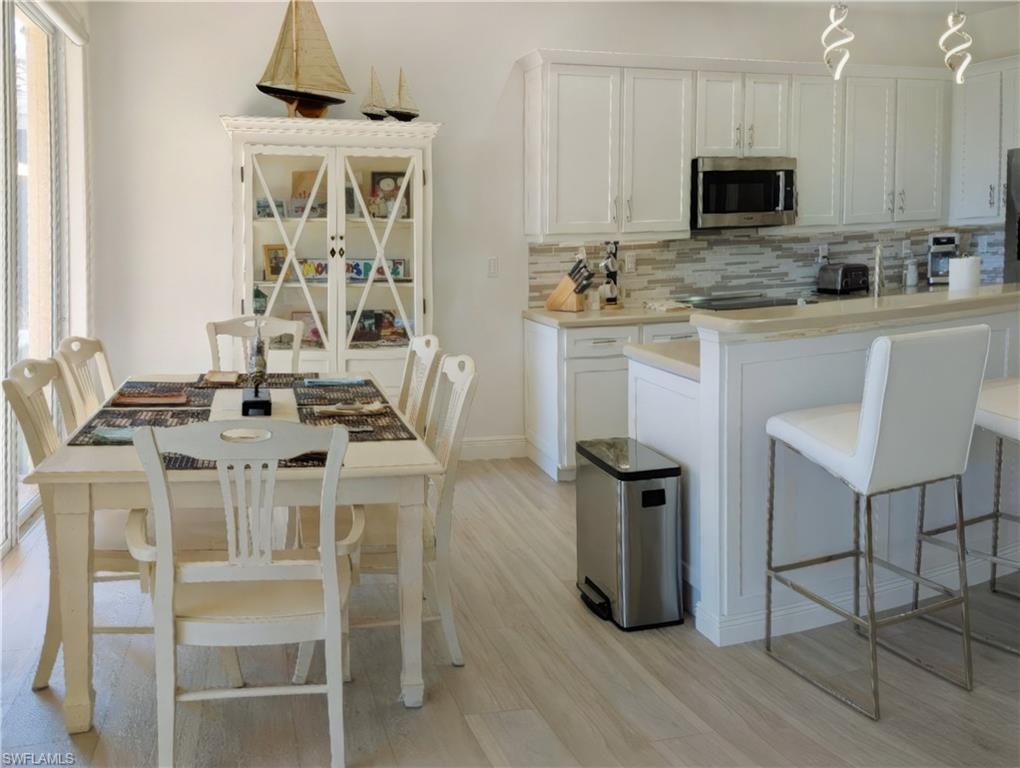 5758 Lago Villaggio Way Naples, FL 34104 - Photo 18 of 42 Breakfast Area with a healthy amount of sunlight