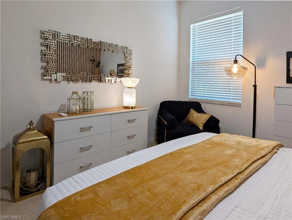 5758 Lago Villaggio Way Naples, FL 34104 - Photo 33 of 42 View of guest bedroom with modern accents