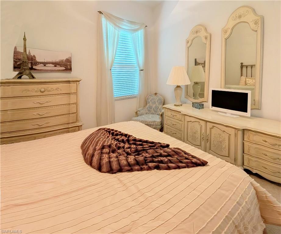 5758 Lago Villaggio Way Naples, FL 34104 - Photo 35 of 42 View of Guest Bedroom with country french accents