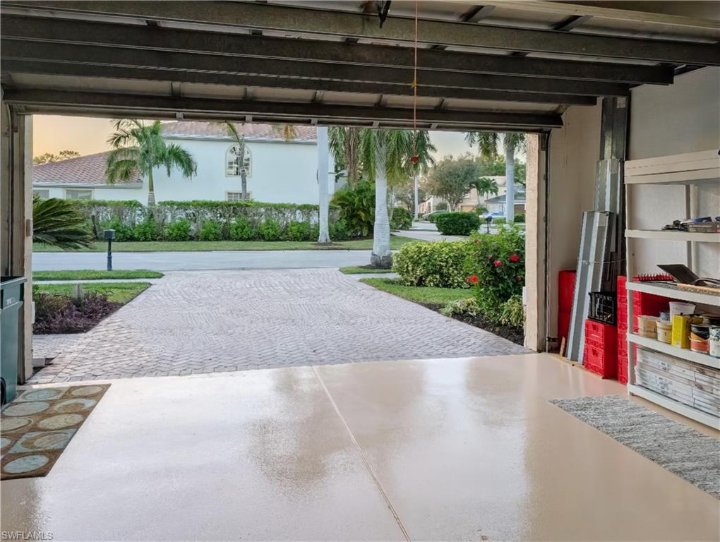 5758 Lago Villaggio Way Naples, FL 34104 - Photo 42 of 42 View of garage at dusk