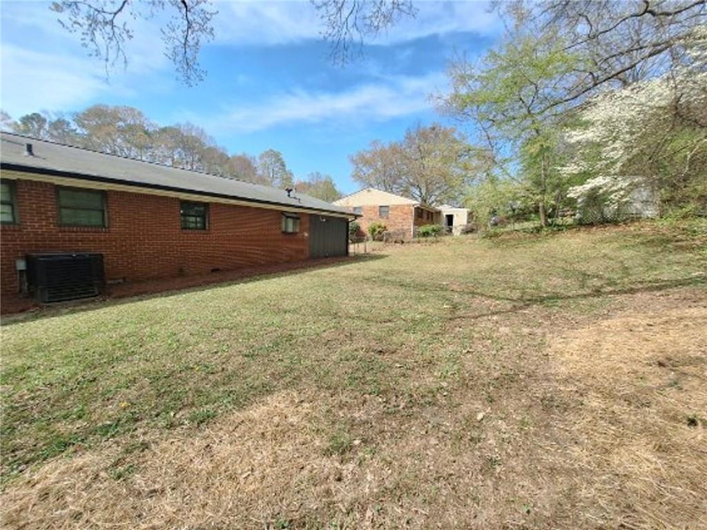 5370 Longmeadow Lane Atlanta, GA 30349 - Photo 13 of 13 a view of a yard with an outdoor space