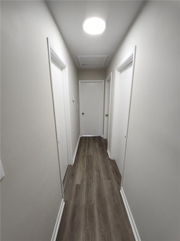 5370 Longmeadow Lane Atlanta, GA 30349 - Photo 7 of 13 a view of a hallway with wooden floor