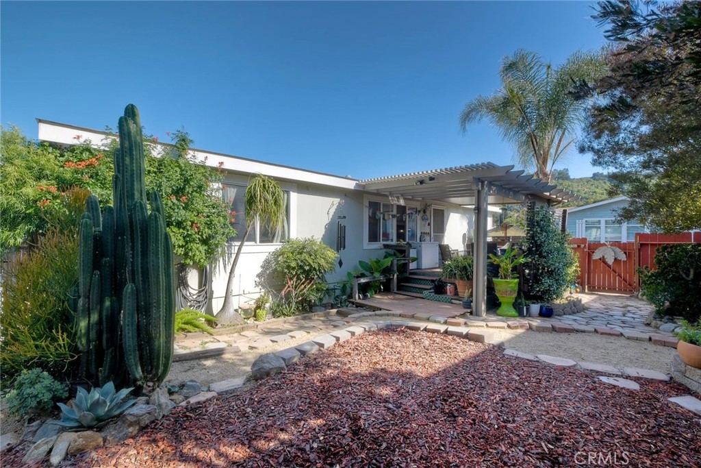 3909 Reche Road, Unit 125 Fallbrook, CA 92028 - Photo 34 of 58 a front view of a house with garden