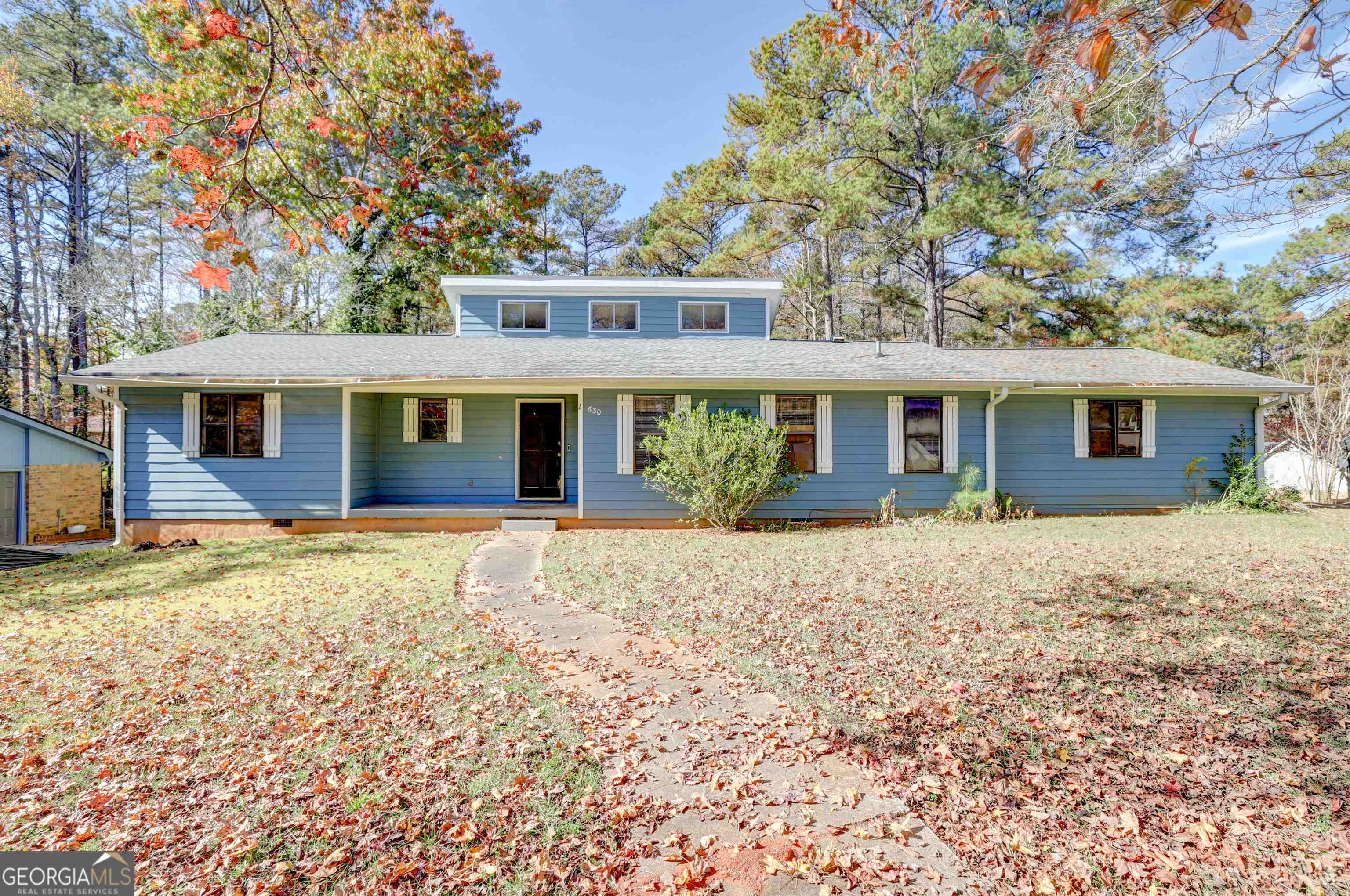 front view of a house with a yard