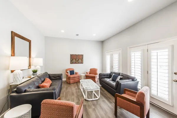 a living room with furniture and a large window