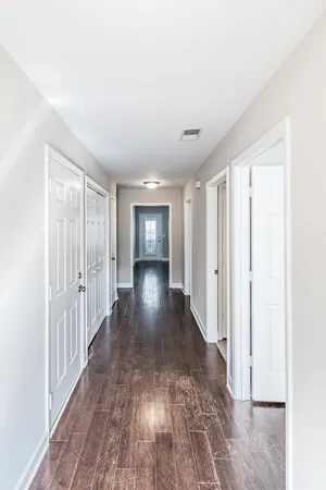 a view of entryway with wooden floor