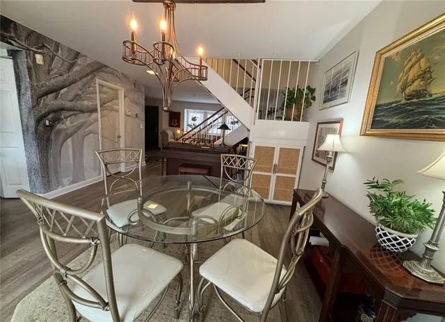 a kitchen with a refrigerator a stove and a window