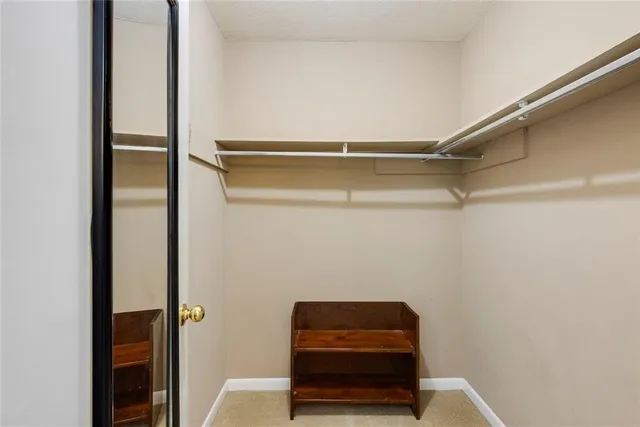 a backyard of a house with trees and outdoor seating