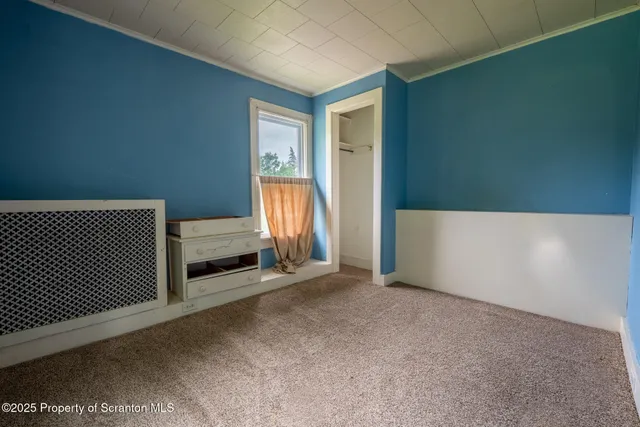 a view of a livingroom with a staircase