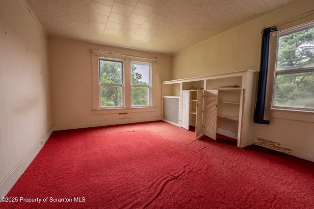 an empty room with windows