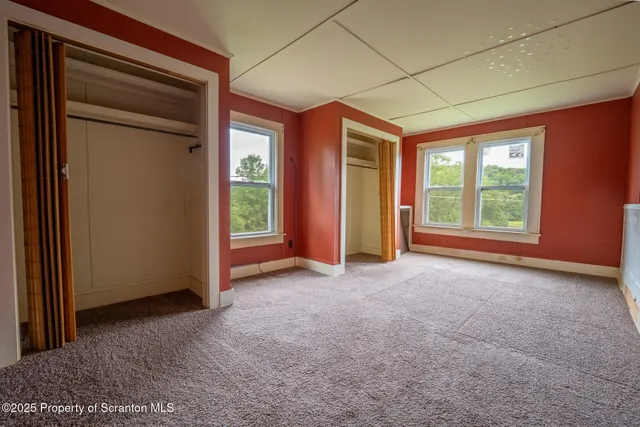 a view of empty room with windows