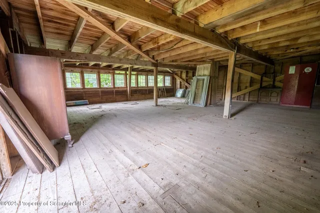 a view of balcony with wooden floor