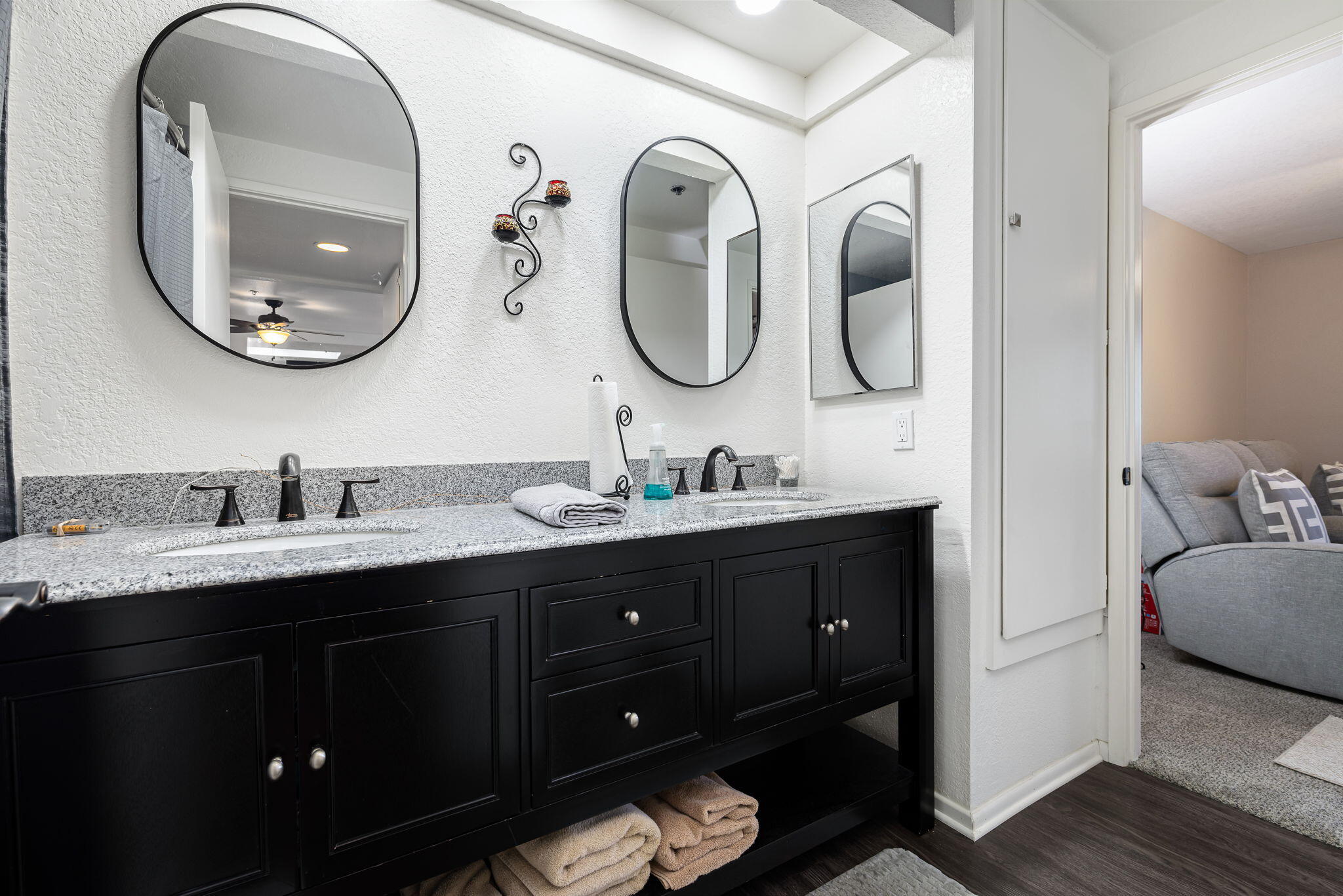 2700 Lawrence Crossley Road, Unit 120 Palm Springs, CA 92264 - Photo 15 of 20 a en suite bathroom with a granite countertop double vanity sinks and a mirror