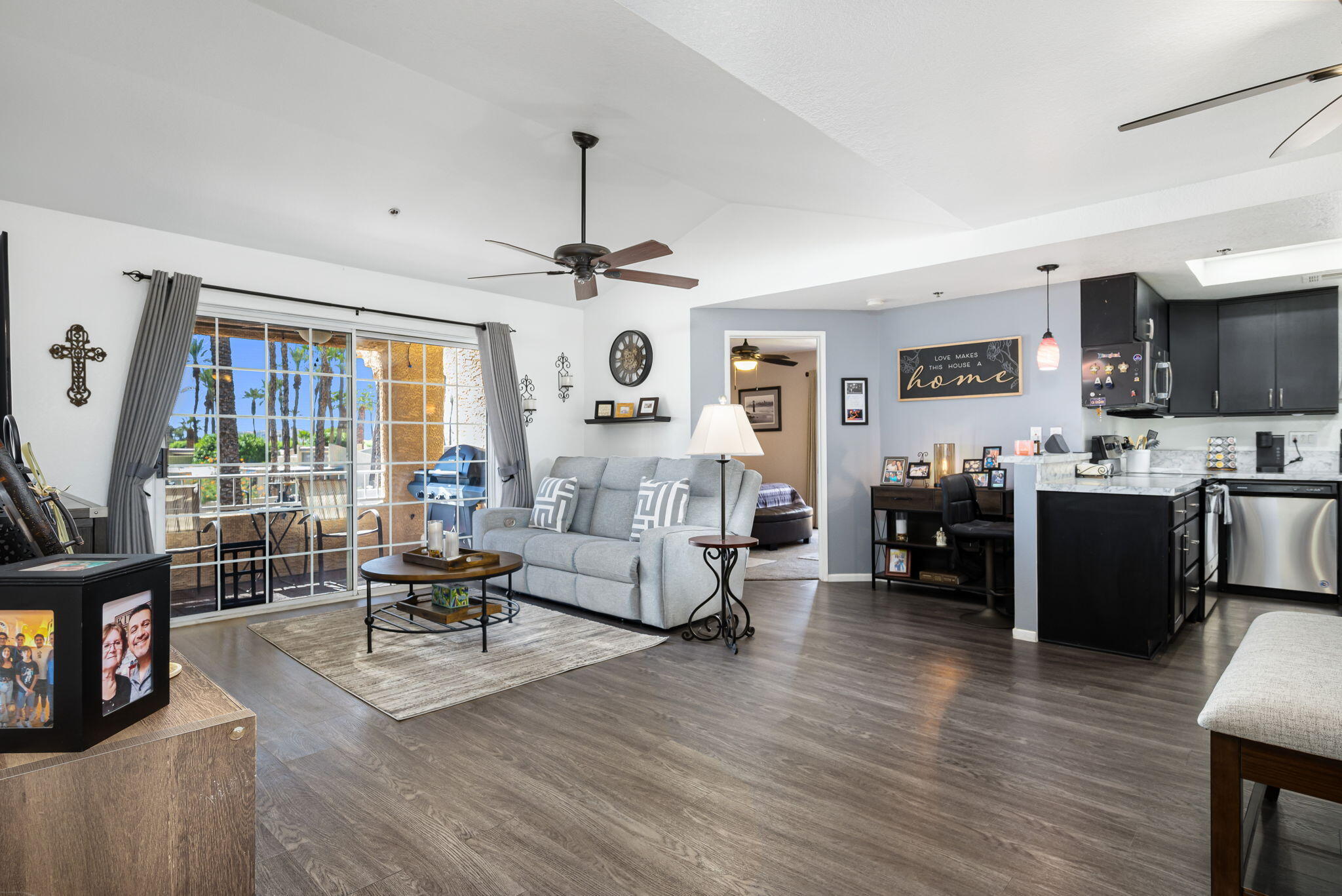 2700 Lawrence Crossley Road, Unit 120 Palm Springs, CA 92264 - Photo 6 of 20 a living room with furniture and a flat screen tv