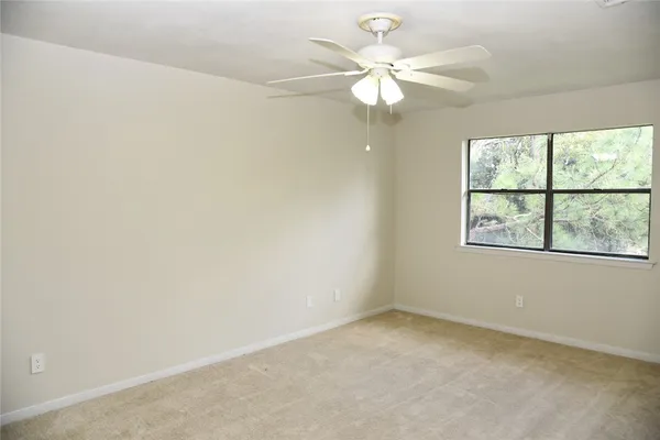 a view of a bedroom with closet area