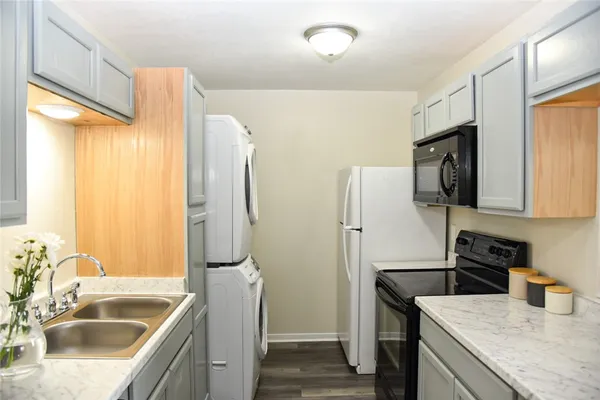 a bathroom with sink a mirror and shower