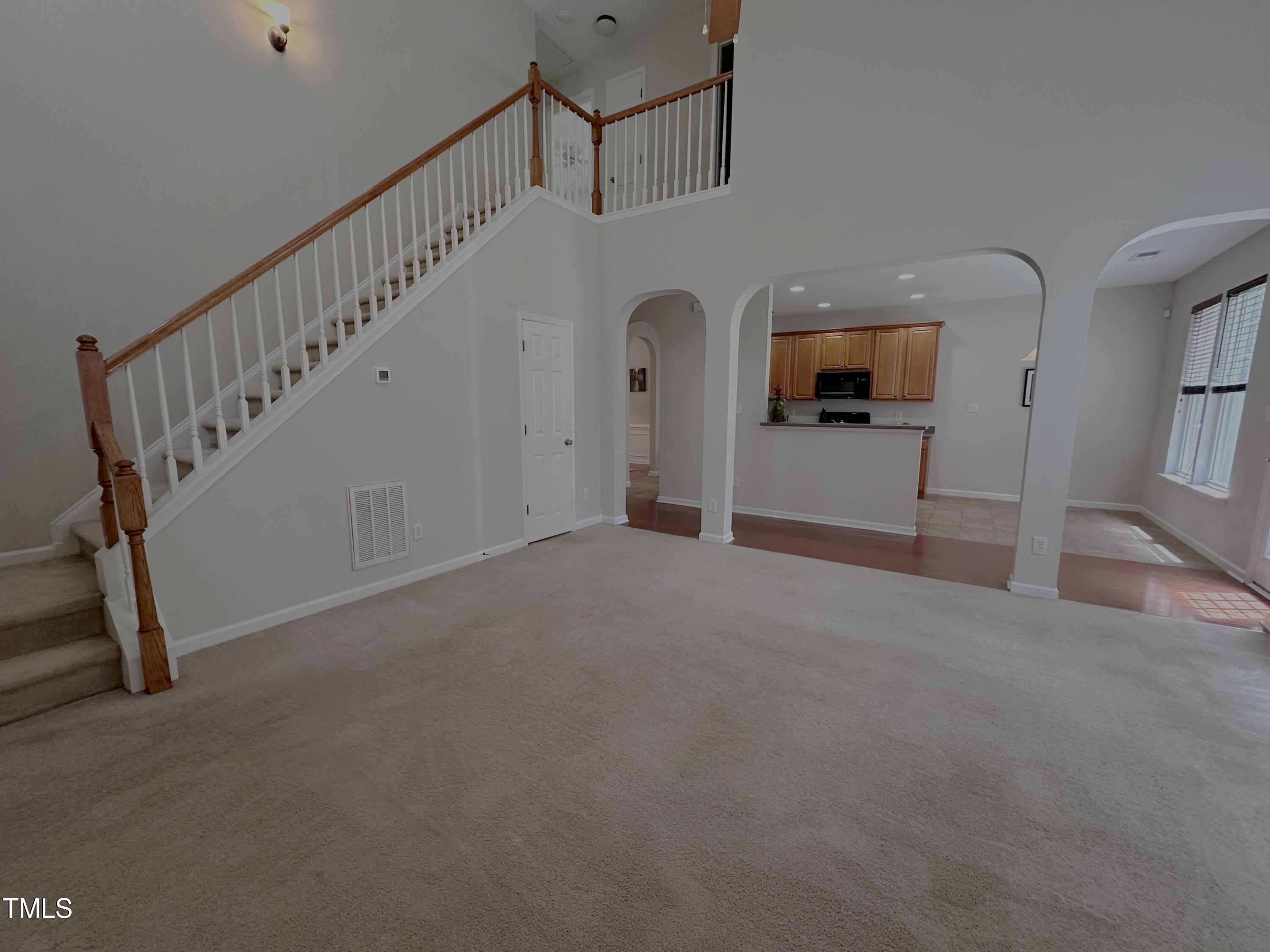 7608 Morrell Lane Durham, NC 27713 - Photo 15 of 34 a view of a livingroom with a staircase