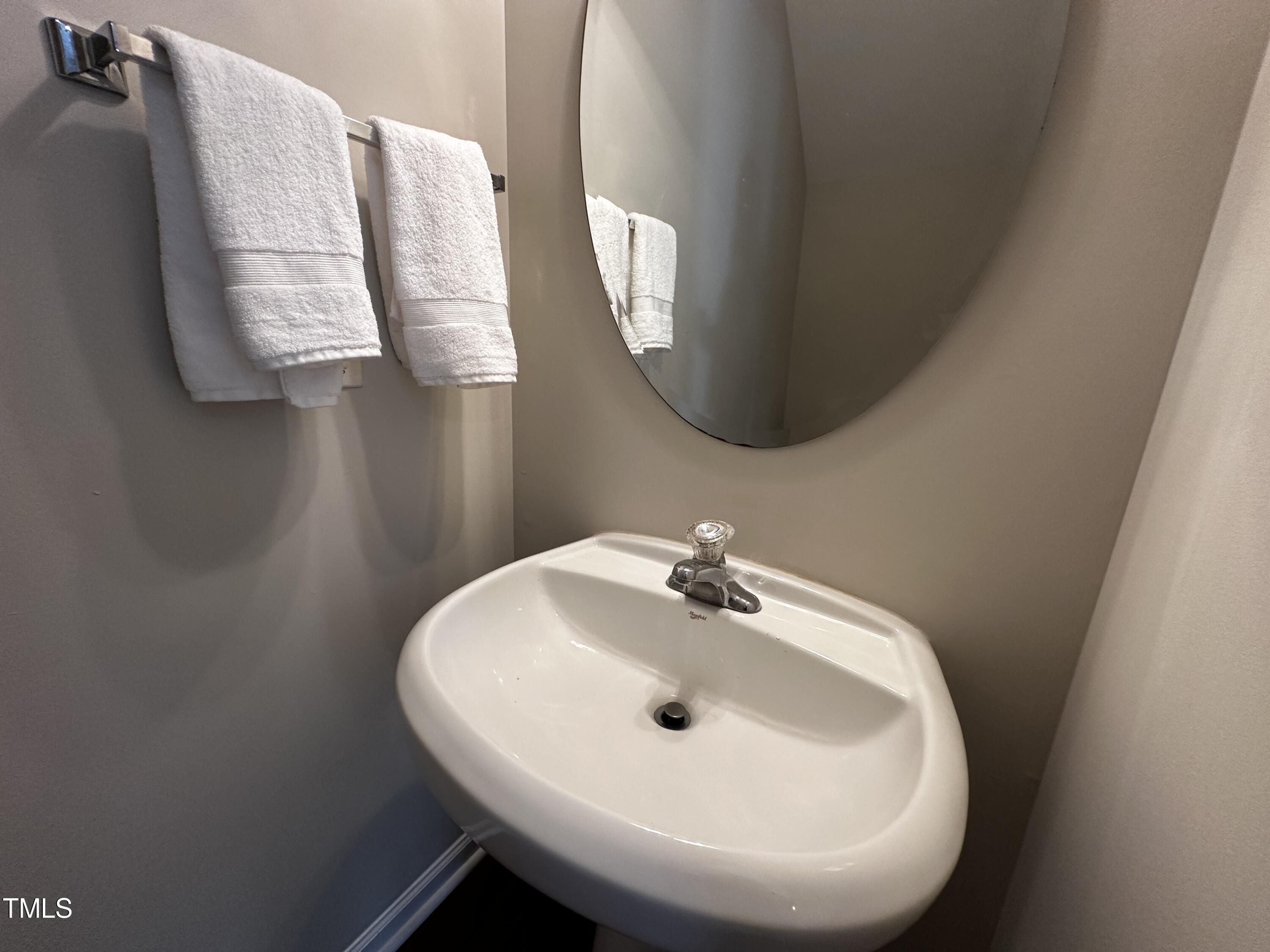 7608 Morrell Lane Durham, NC 27713 - Photo 17 of 34 a bathroom with a sink and mirror