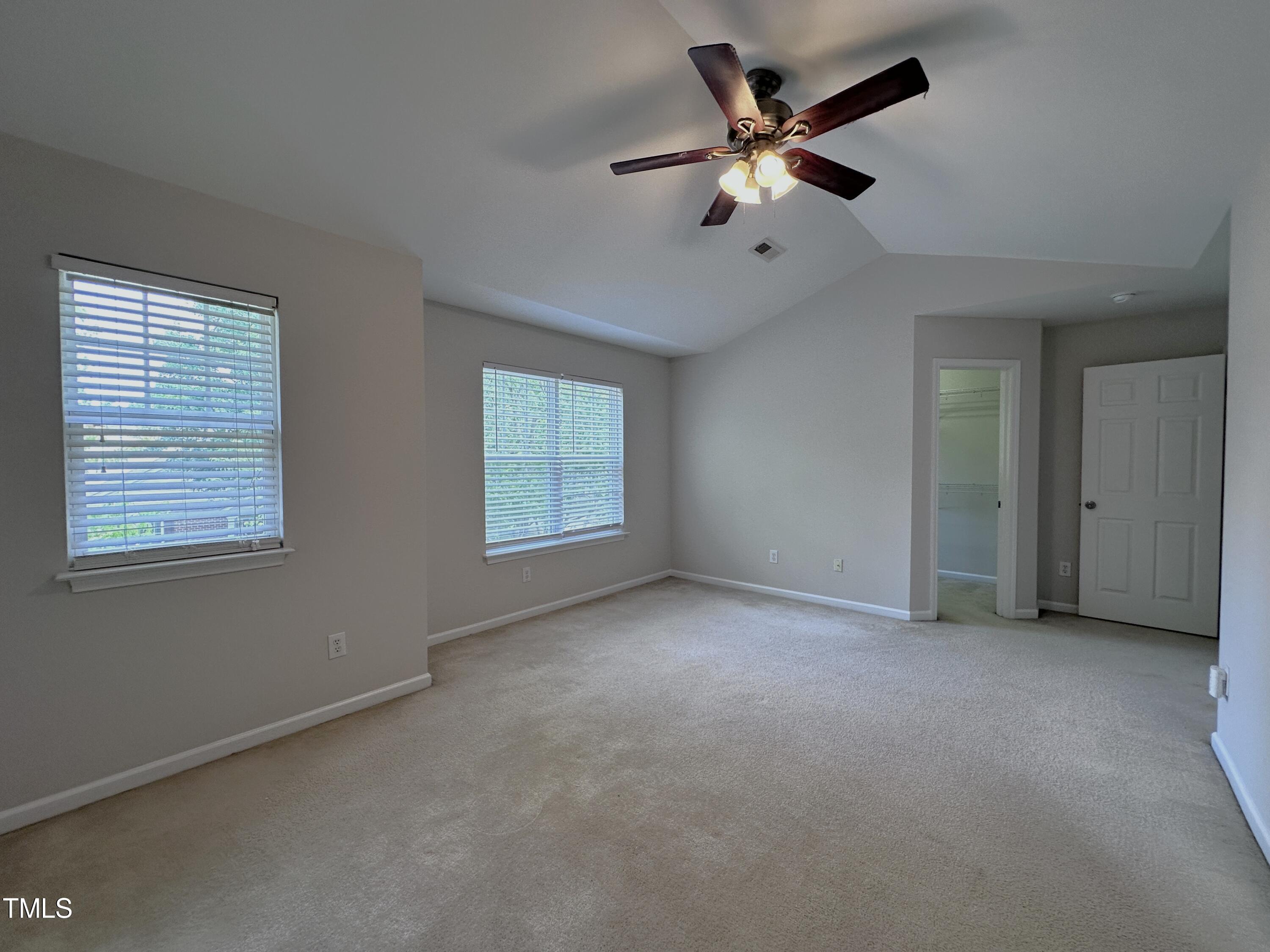 7608 Morrell Lane Durham, NC 27713 - Photo 19 of 34 an empty room with windows and fan