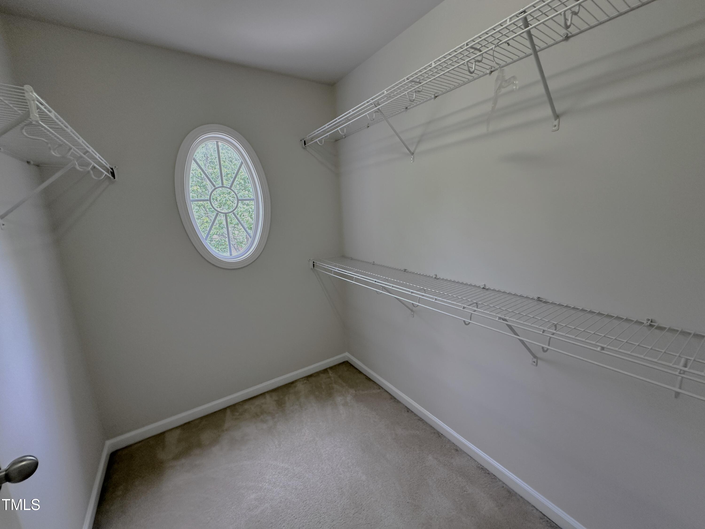 7608 Morrell Lane Durham, NC 27713 - Photo 23 of 34 a view of a room with racks on the wall