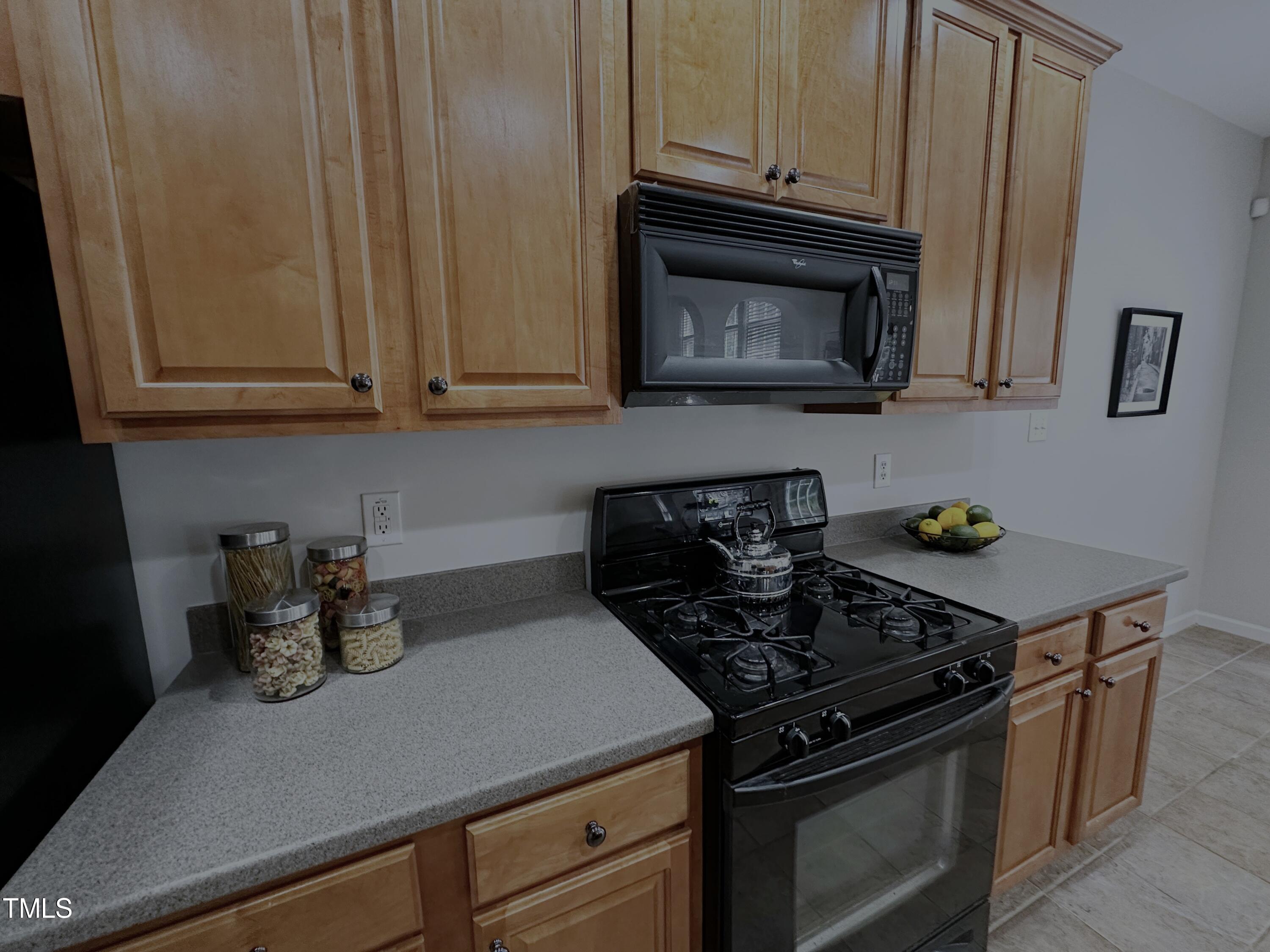 7608 Morrell Lane Durham, NC 27713 - Photo 10 of 34 a kitchen with granite countertop stainless steel appliances and cabinets