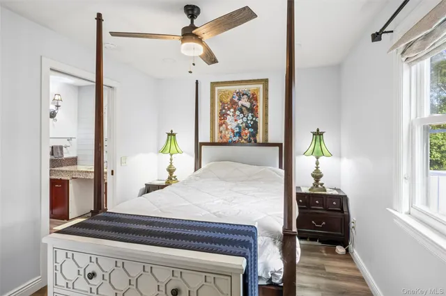 a bedroom with furniture and wooden floor