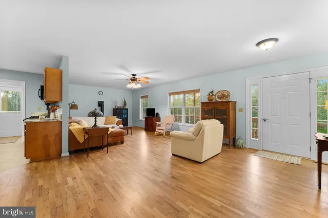 a view of entryway with furniture and windows