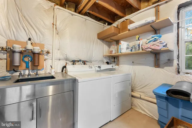 a view of workspace with hardwood floor and a ceiling fan