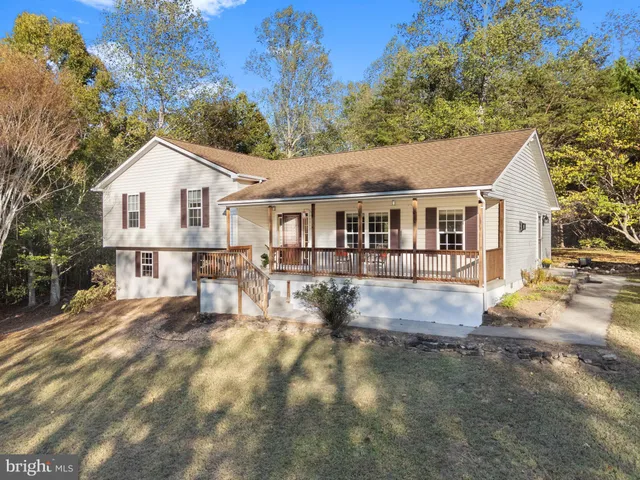 a view of a backyard with sitting area