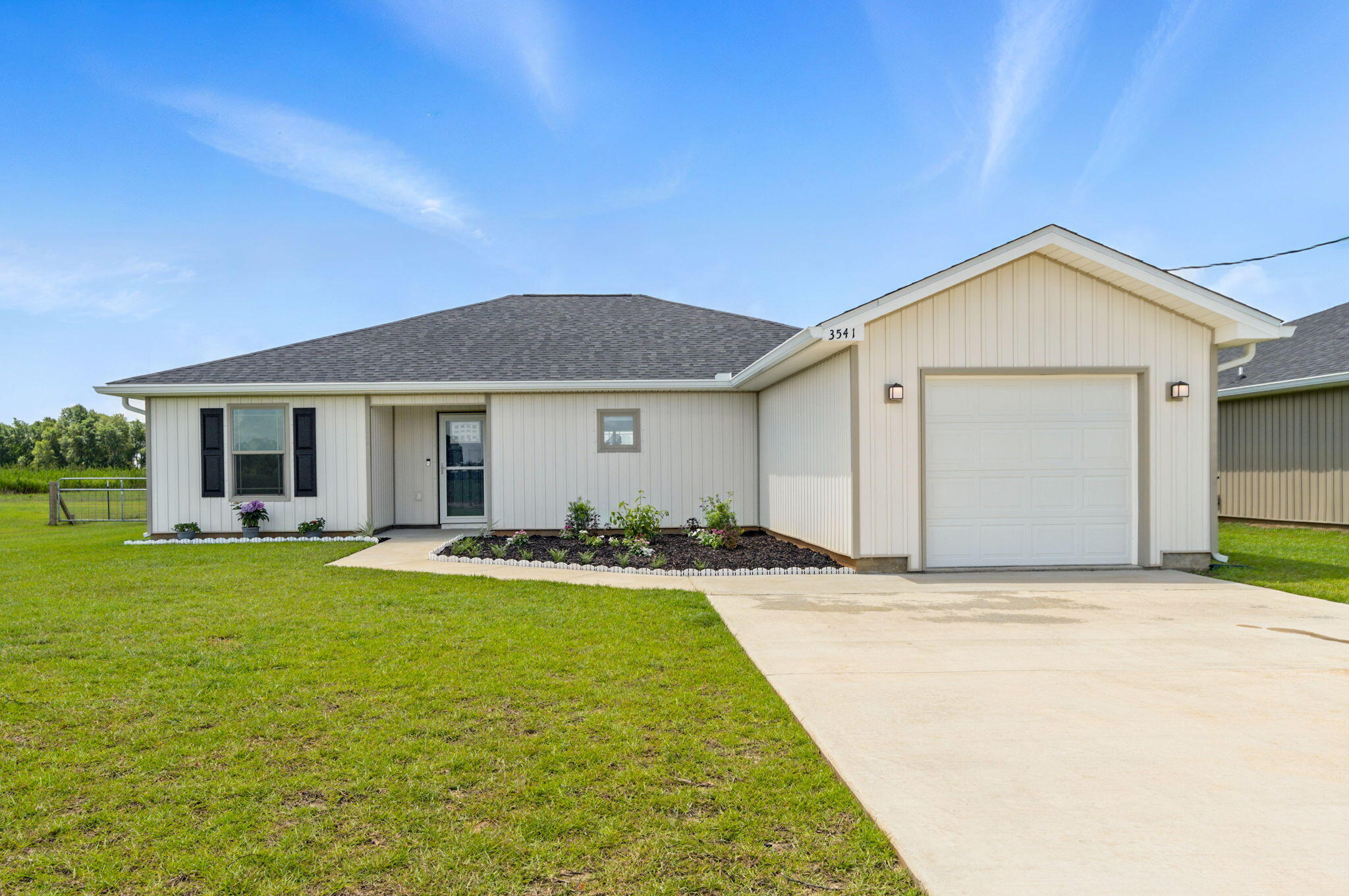 3541 Godwin Road Jay, FL 32565 - Photo 1 of 28 a front view of a house with yard and outdoor seating
