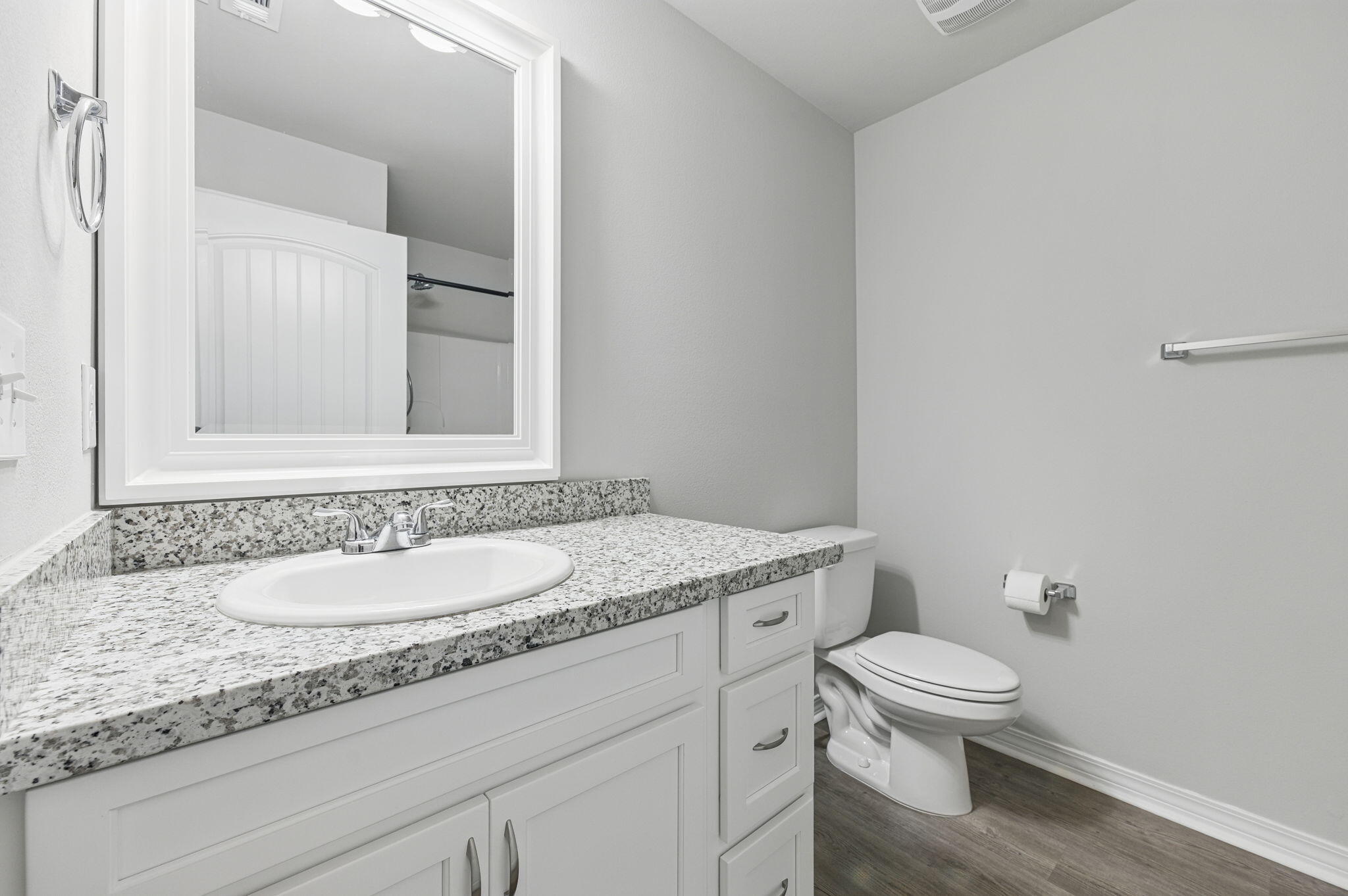 3541 Godwin Road Jay, FL 32565 - Photo 17 of 28 a bathroom with a granite countertop toilet sink and mirror