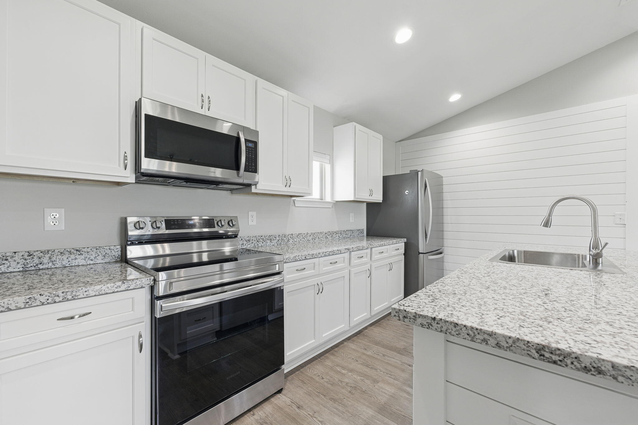 3541 Godwin Road Jay, FL 32565 - Photo 7 of 28 a kitchen with stainless steel appliances granite countertop a stove microwave and sink