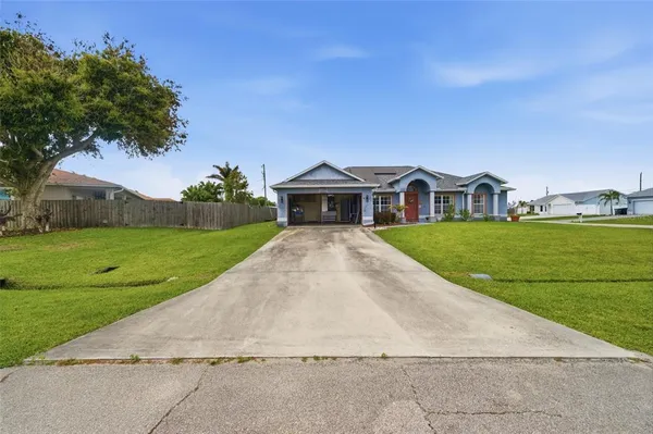 a view of house with garden space and street view